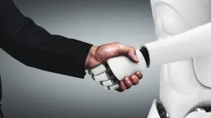 man and robot shaking hands