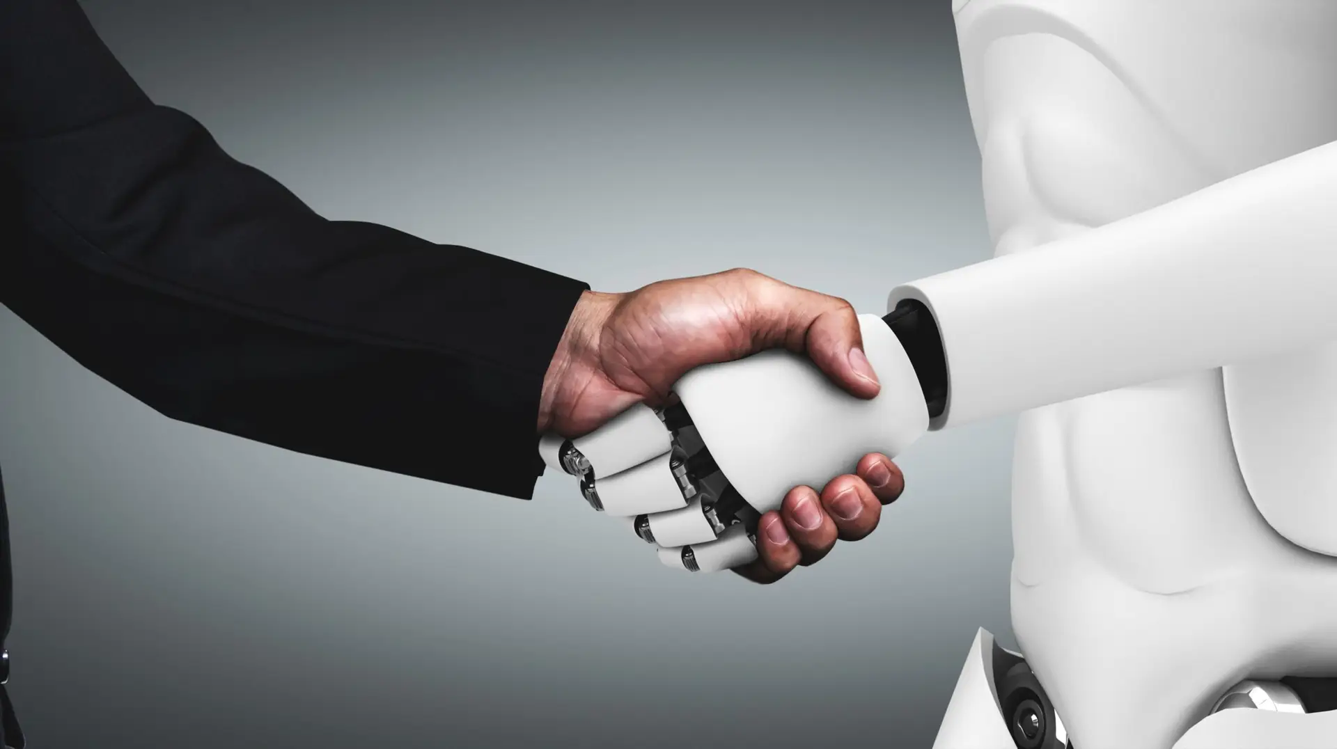 man and robot shaking hands