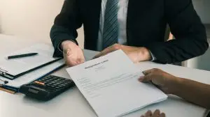 man in a office handed a resignation letter