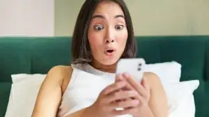 Asain girl watching a social media trend on her phone