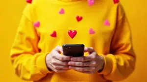 phone with hearts coming out