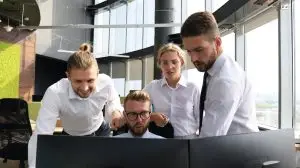 Group of young people working to find the latest ai news