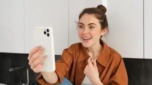woman recording herself on a phone explaining a content trend
