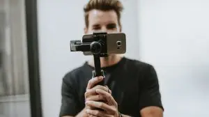 Man recording himself doing a new social media trend