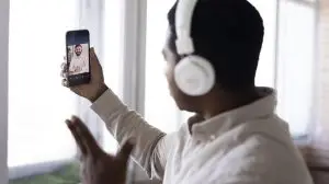 man recording himself posting a new trend on social media
