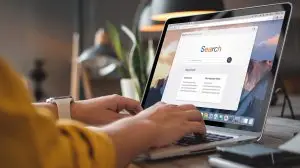 woman on computer searching for ai news