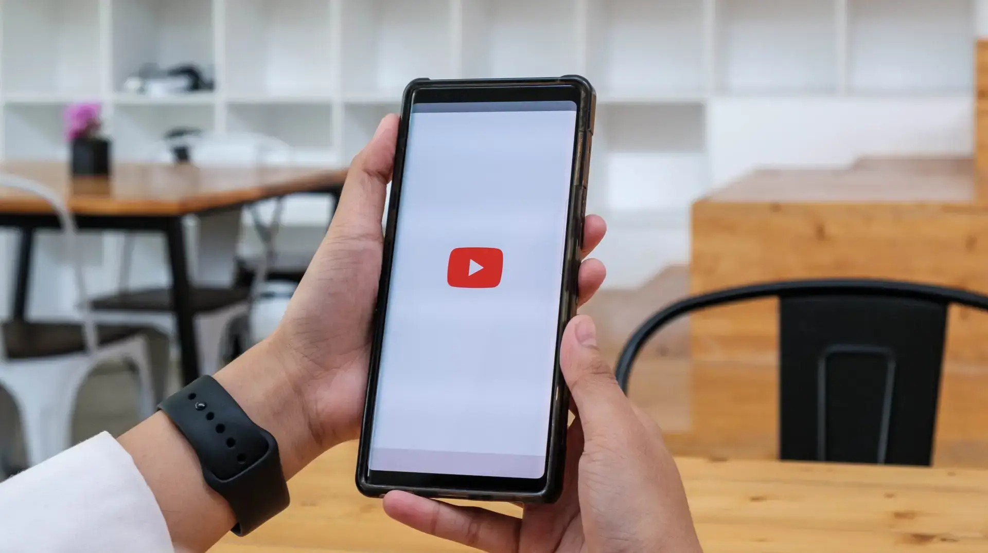 Woman on phone watching youtube