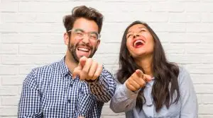 Couple laughing at a funny social media trend