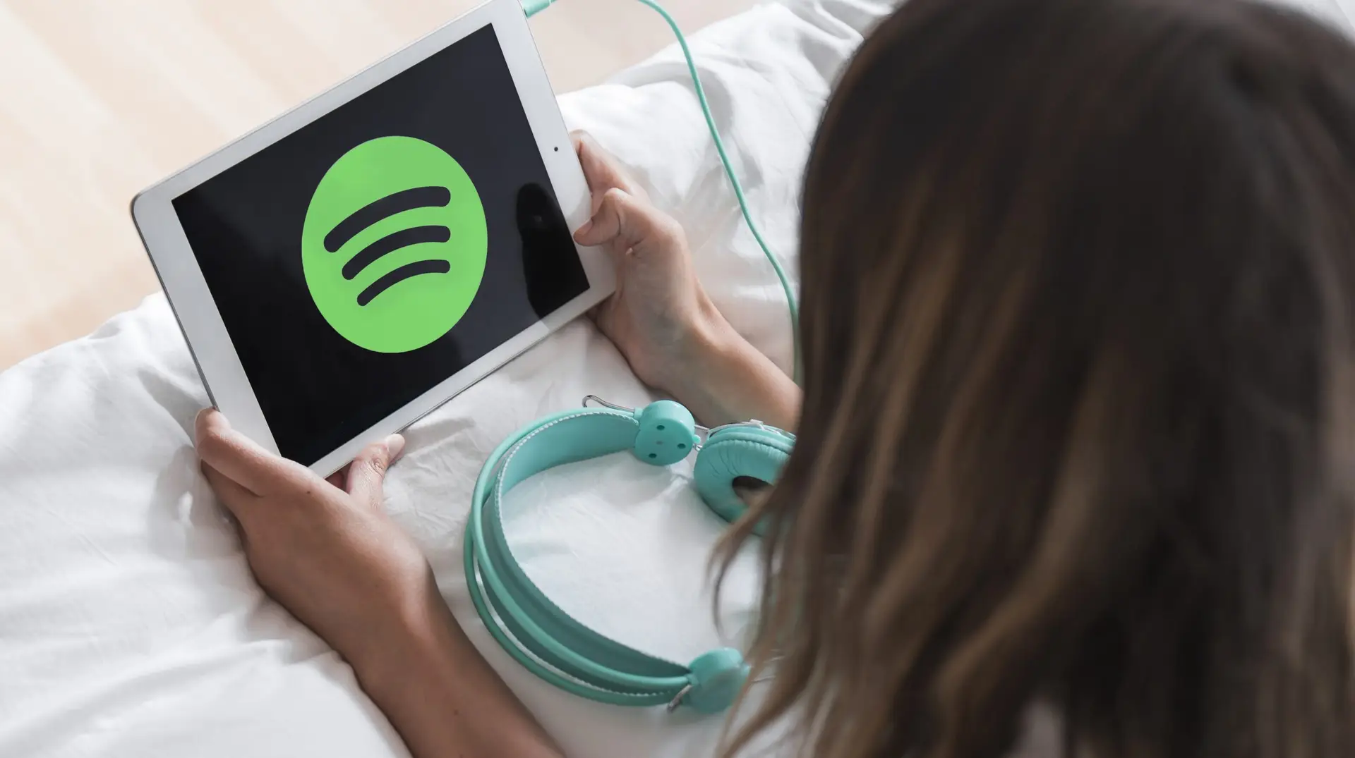 woman listening to spotify to latest ai news