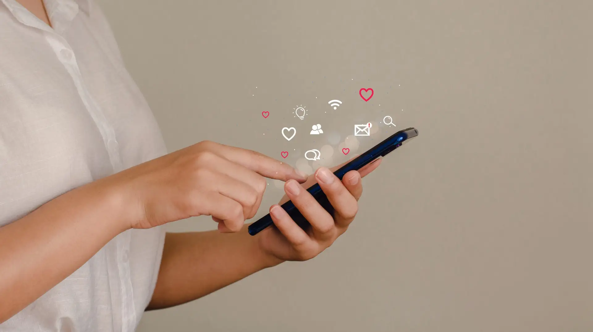 young woman using smartphone with social icon pop-up A young business woman is using a mobile phone to search the Internet for information and social media. technology concept and people