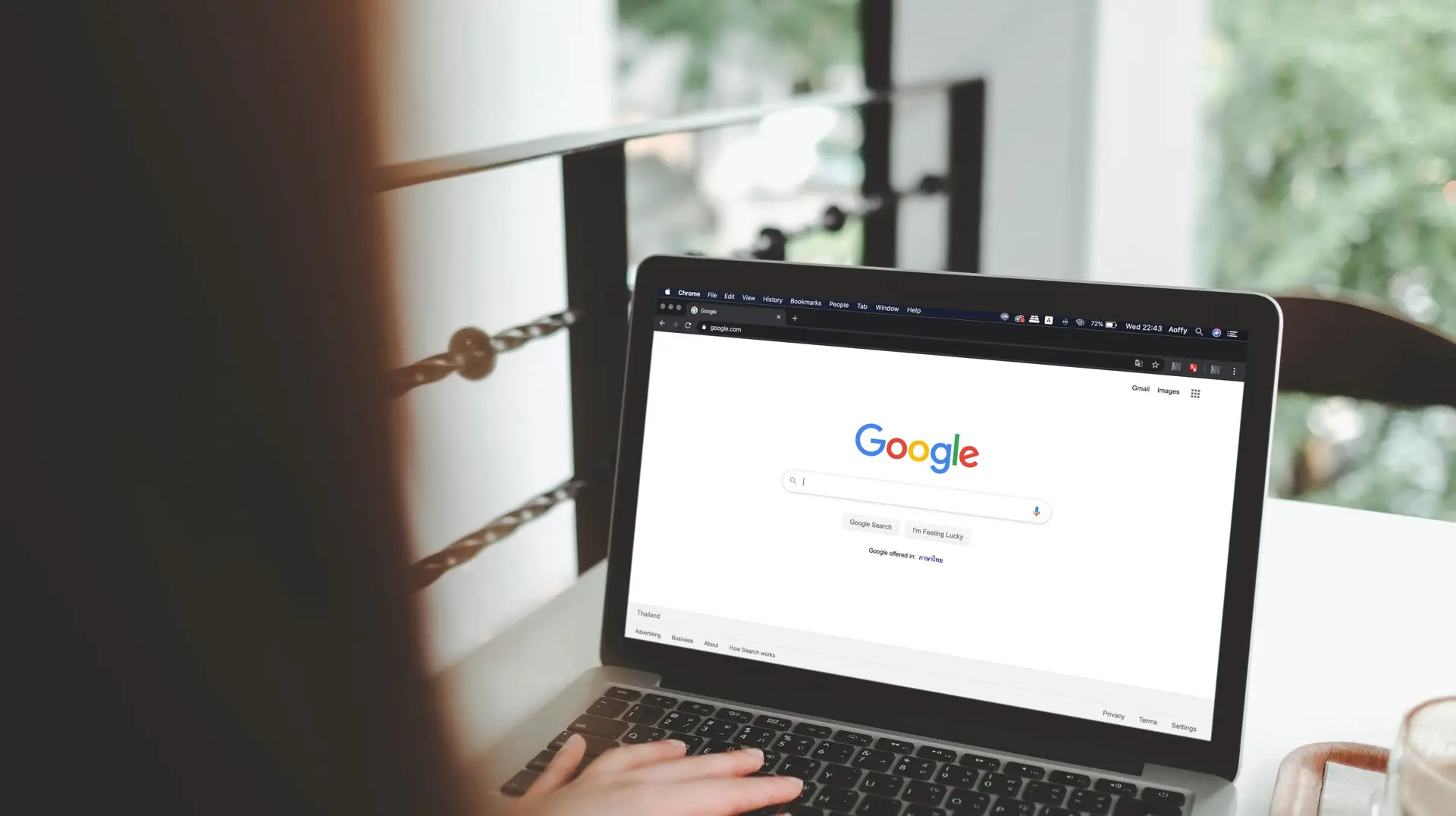 woman on a computer with Google opened.