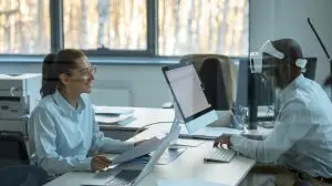 people working on computers in an office