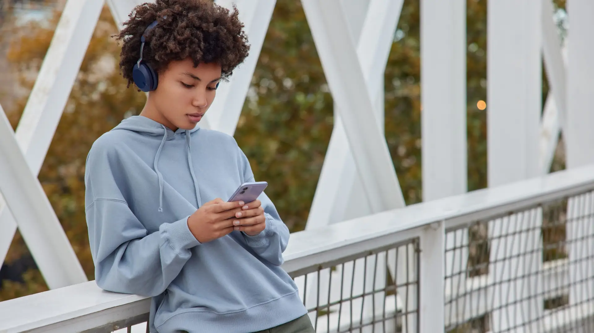 Woman listening to an audio on her phone