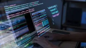 man coding on a computer