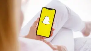 Riga,,Latvia,-,March,26,,2021:,Woman,Holding,Phone,With