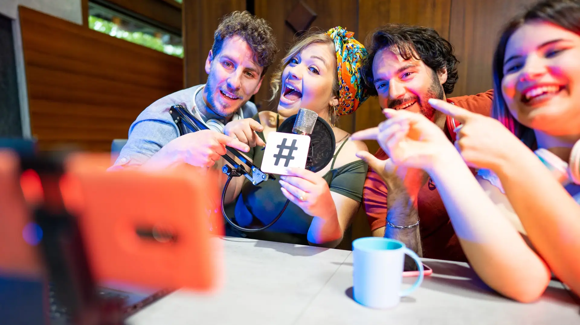 Group,Of,Friends,Conducting,Live,Streaming,Radio,Program,And,Reminding