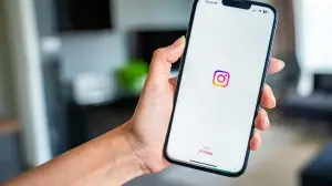 Prague,,Czech,Republic,-,May,2,,2024:,Woman,Holding,Iphone