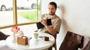 Young,Man,With,A,Beard,Focused,On,Writing,In,A