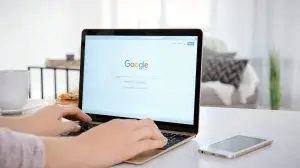 Kiev,,Ukraine,-,October,10,,2017:,Woman,Using,Apple,Macbook