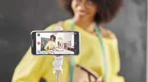 Woman recording herself for a content trend