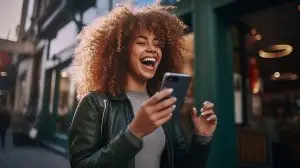 woman laughing at her phone