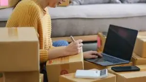 Starting small businesses SME owners female entrepreneurs check online orders to prepare to pack the boxes, sell to customers, sme business ideas online.