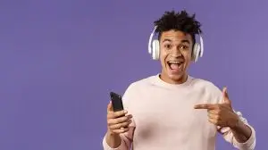 man listening to a tiktok song with headphones on