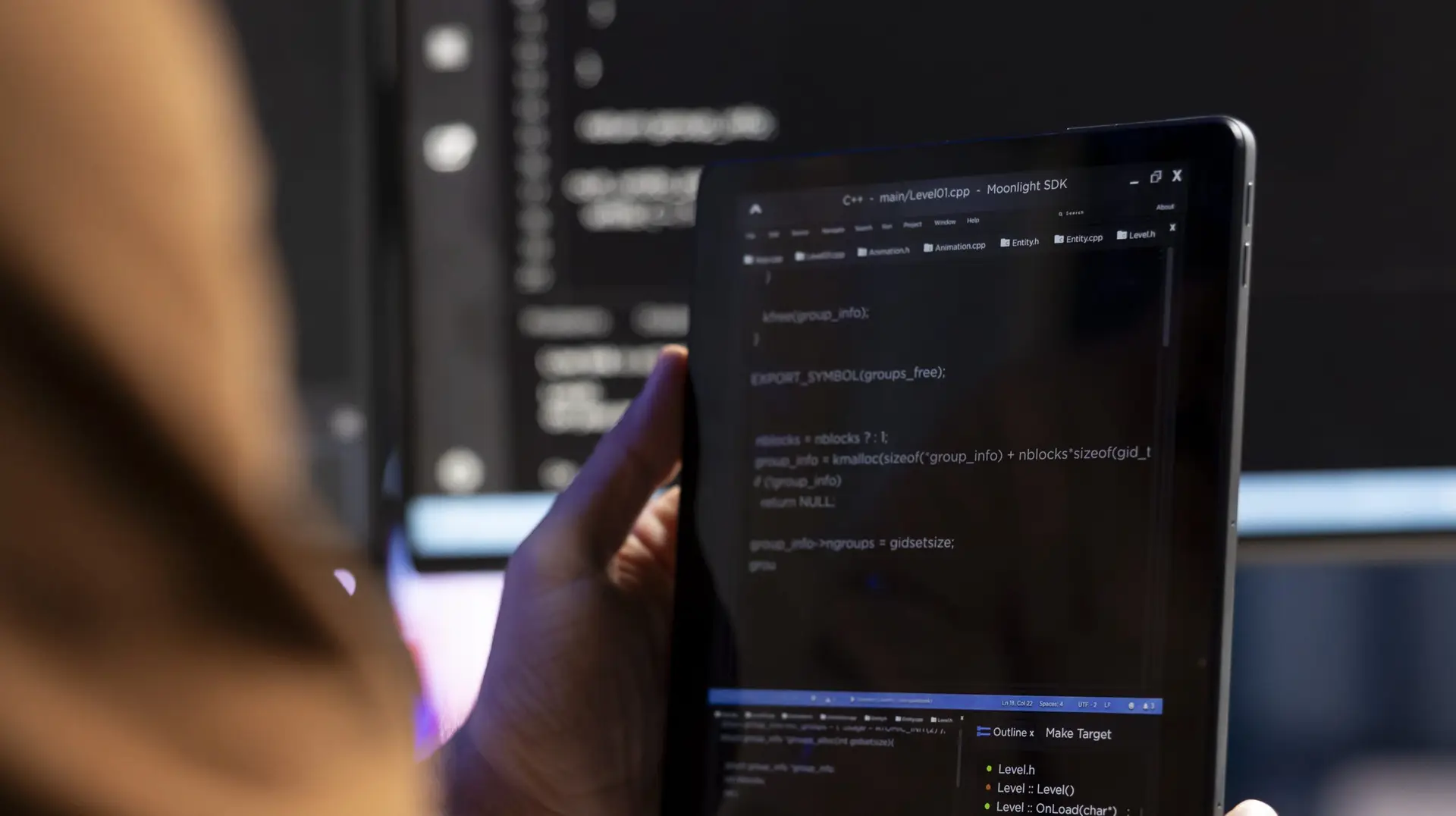 Teleworking programmer designing and developing software using tablet