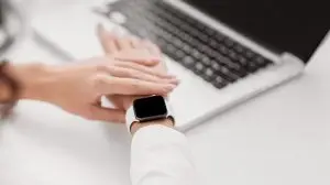 Unrecognizable girl checking time on her wristwatch