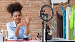 Woman influencer shoot live streaming vlog video review makeup crucial social