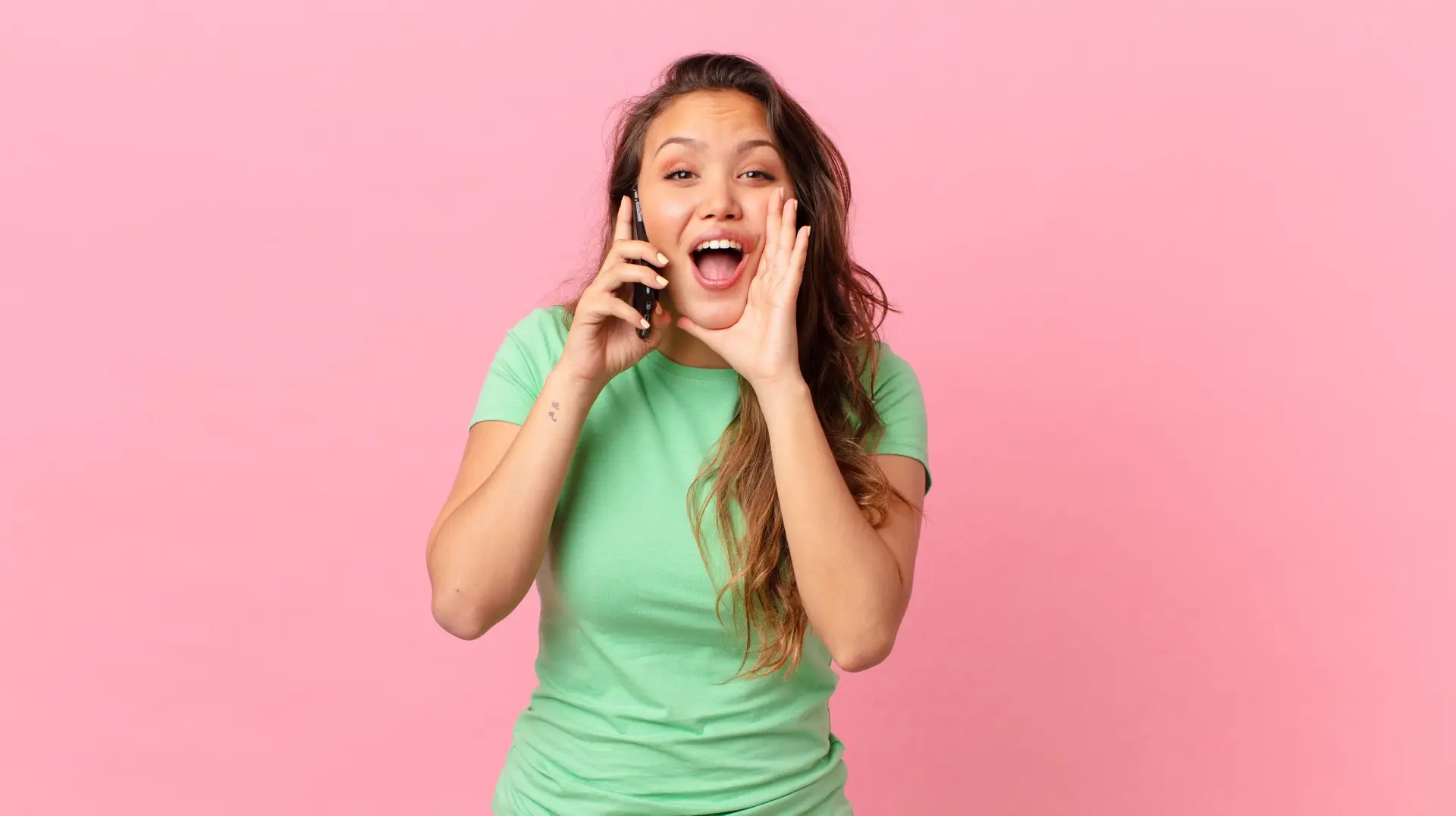 feeling happy,giving a big shout out with hands next to mouth