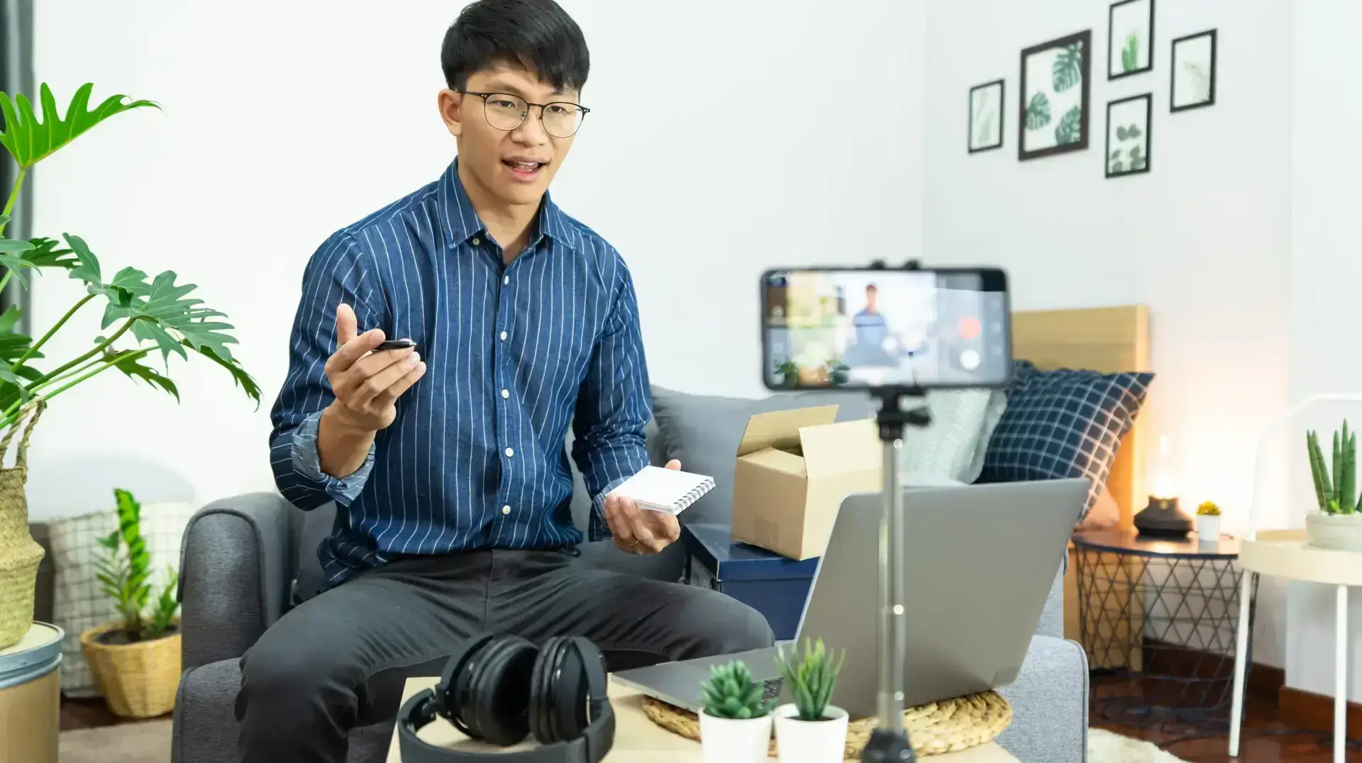 Asian,Man,Technology,Blogger,Or,Social,Media,Influencer,Presenting,And