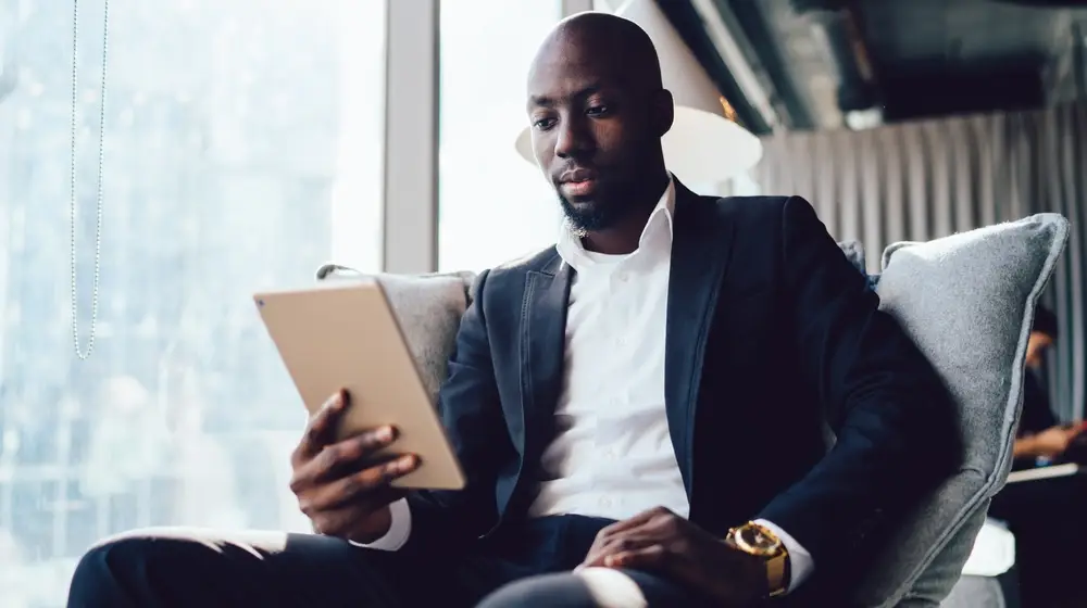 Successful,Male,Entrepreneur,Dressed,In,Formal,Reading,Information,About,Web