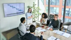 Senior,Female,Ceo,And,Multicultural,Business,People,Discussing,Company,Presentation