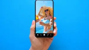 Mobile,Phone,On,Blue,Background,With,Shared,Video,On,Sample