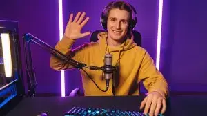 Young,Handsome,Vlogger,Pro,Gamer,Waving,Hand,To,Camera,,Says