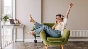 Caucasian,Beautiful,Woman,Smiling,At,Home,In,Headphones,.,Short