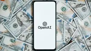 Openai,Company,Logo,On,Screen,Of,Smartphone,Lying,On,Money