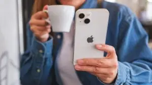 Feb,8th,2023,:,A,Woman,Holding,And,Using,Iphone