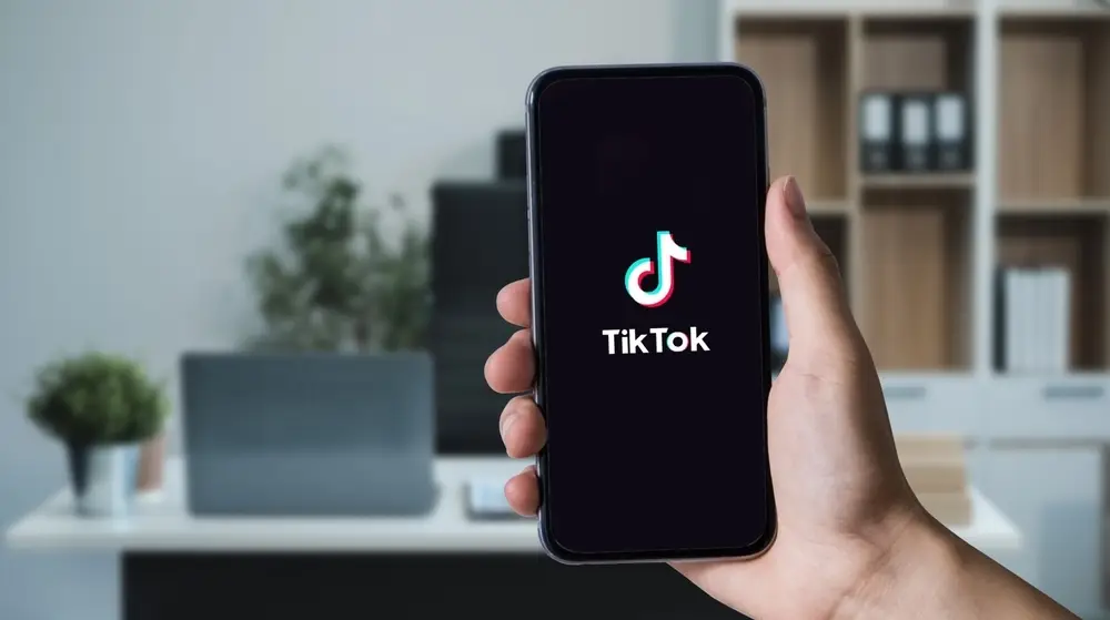 Closed,Up,Image,Of,A,Female,Using,Tiktok,Application,On