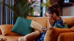 Relaxing,At,Home,Woman,Sitting,On,Couch,With,Eyes,Closed