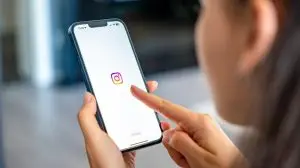 Prague,,Czech,Republic,-,May,2,,2024:,Woman,Holding,Iphone