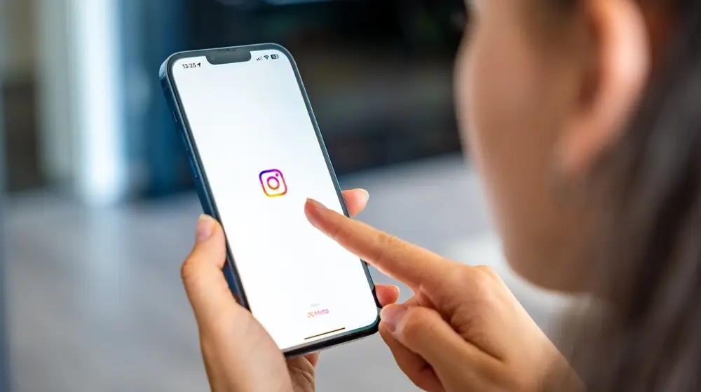 Prague,,Czech,Republic,-,May,2,,2024:,Woman,Holding,Iphone