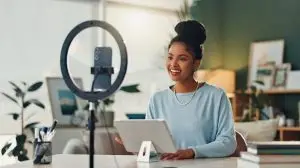 Woman,,Influencer,And,House,With,Smartphone,For,Social,Media,Or