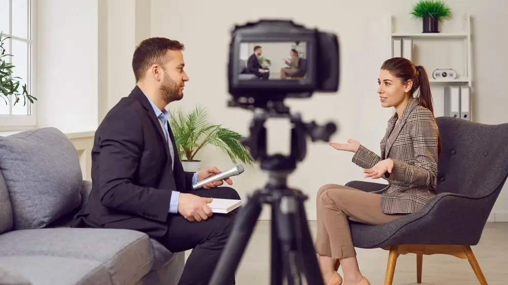 Man,Is,Conducting,An,Interview,With,A,Woman,,Recording,It