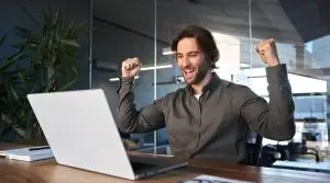 Excited,Happy,Business,Man,Winner,Celebrating,Success,Looking,At,Laptop