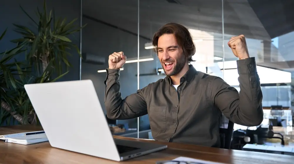 Excited,Happy,Business,Man,Winner,Celebrating,Success,Looking,At,Laptop