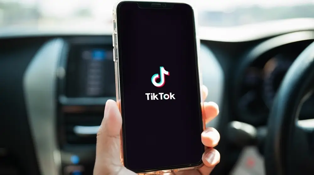 Closed,Up,Image,Of,A,Male,Using,Tiktok,Application,On