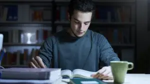 Teenage,Student,Reading,Books,And,Studying,Late,At,Night,,Learning