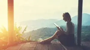 Female,Is,Typing,Something,In,Diary,On,Touch,Pad,,While